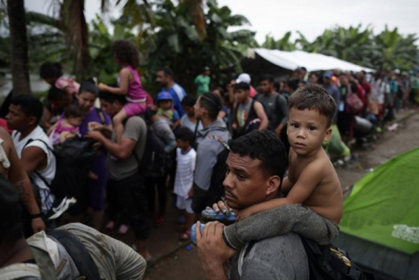 Migrants line up to be transferred in canoes to the humanitarian shelters of Lajas Blancas, at the indigenous town of Bajo Chiquito, Panama, in September 2023. The U.N. rights office warned that the unprecedented number of migrants crossing the dense tropical jungle between Colombia and Panama known as the Darien Gap weree risking their lives and facing horrific human rights abuses. File Photo by Bienvenido Velasco/EPA