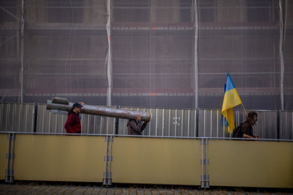 People carry a large mock-up missile as people gather in support of Ukraine following Russian drone violations of Polish airspace in recent days, in Prague, Czech Republic, on Saturday, the same day Romania reported Russian drone violations of its airspace. Photo by Martin Divisek/EPA