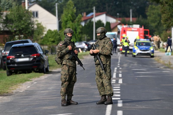 Polish troops man a perimeter guard as emergency services respond to a report of damage to a residential building in Wyryki in eastern Poland after Russian drones penetrated the country's airspace overnight. Photo by Wojtek Jargilo/EPA