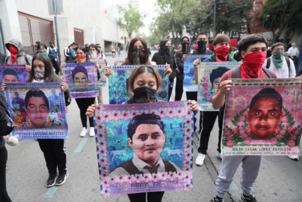 Relatives and friends of 43 missing students hold pictures during a protest in Mexico City on Wednesday in front of the Mexican Ministry of Foreign Affairs to demand the extradition from Israel of two alleged perpetrators of the forced disappearances from Ayotzinapa Rural Teachers' College in the state of Guerrero in 2014. Photo by Mario Guzman/EPA