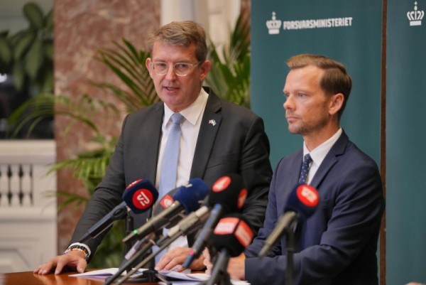 Danish Defense Minister Troels Lund Poulsen (L) and Danish Justice Minister Peter Hummelgaard (R) told a news conference in Copenhagen that recent disruption to air travel caused by drones flying in and around airports, including several incidents on Wednesday night, bore all the hallmarks of a hybrid attack. Photo by Emil Helms/EPA