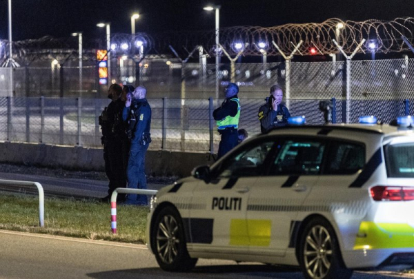 Danish police officers are present at Copenhagen Airport, where drones were spotted. The airport reopened early Tuesday. Photo by Steven Knap/EPA