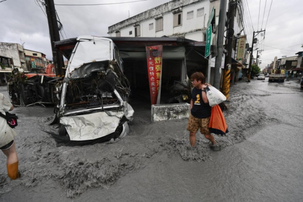 The aftermath of deadly flooding in Guangfu Township, Hualien County, in eastern Taiwan, caused by a supertyphoon hundreds of miles away that left at least 14 people dead and more than 100 missing. Photo by Ritchie B. Tongo/EPA