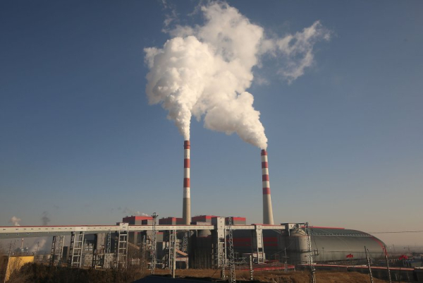 Smoke billows from a coal-fired power station in Datong in the heart of Shanxi Province's coal country. China on Wednesday committed to slashing emissions from burning fossil fuels by 7%-10% by 2035, the first such pledge it has ever made. File photo by Stephen Shaver/UPI