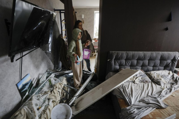Liya, 11, and her mother Hanna, 32, inspect the damage inside their home near an area targeted by Russian strikes, in Kyiv, Ukraine, on Sunday. Russia launched a large-scale overnight attack across Ukraine using nearly 500 drones and 40 missiles, killing at least four people and injuring scores. Photo by Sergey Dolzhenko/EPA