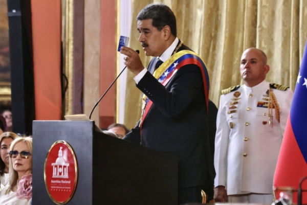 A handout photo made available by the Cuban Presidency shows Venezuela's President Nicolas Maduro (C) delivering a speech on the day of his inauguration as president, in Caracas, Venezuela, in January. On Monday, Maduro announced Venezuela would close its embassies in Norway and Australia while opening new embassies in Burkina Faso and Zimbabwe. File Photo by Alejandro Azcuy/EPA
