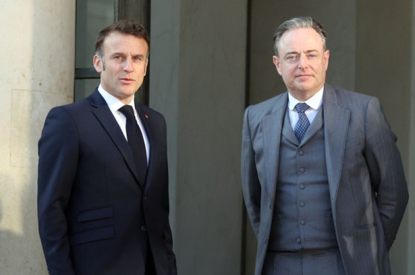 French President Emmanuel Macron greeted Belgian premier Bart De Wever, right, at the Elysee Palace in Paris on March 27. On Thursday, Belgian authorities intercepted a plot to attack De Wever and other Belgian leaders. File Photo by Maya Vidon-White/UPI