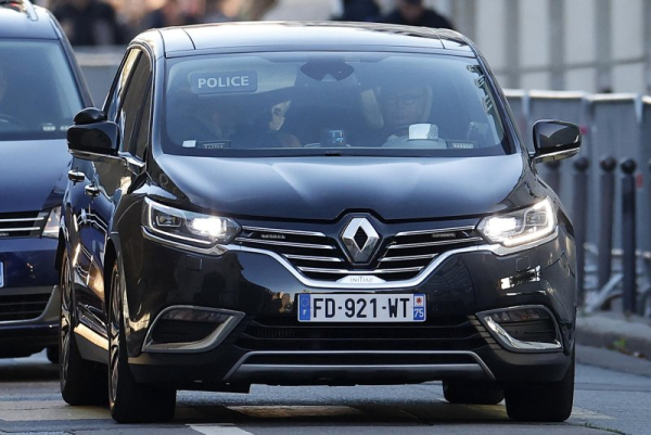 A police convoy transports former French President Nicolas Sarkozy (C, in car) to La Sante prison in Paris on Tuesday to begin a five-year sentence related to a campaign finance scandal involving money from Libya. Photo by Yoan Valat/EPA