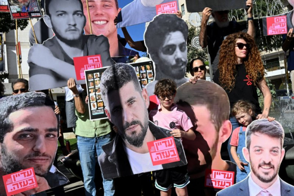 Israelis marked the second anniversary of the Oct. 7 attacks on Tuesday, carrying portraits of hostages held by Hamas. Photo by Debbie Hill/ UPI