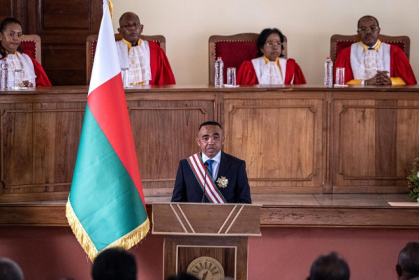 Col. Michael Randrianirina addresses the Constitutional Court in Antananarivo, Madagascar, on Friday after being sworn in as president. The former provincial politician swapped his fatigues for a business suit for the ceremony. Photo by Henitsoa Rafalia/EPA