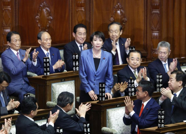 Sanae Takaichi (C) acknowledges her fellow lawmakers after being elected as the new prime minister during the general assembly of an extraordinary parliamentary session in Tokyo, Japan, on October 21, 2025. Photo by Franck Robichon/EPA
