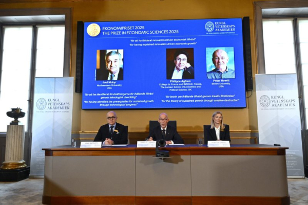 John Hassler (L), chairman of the Committee for the Prize in Economic Sciences in Memory of Alfred Nobel; Hans Ellegren (C), permanent secretary of the Academy of Sciences; and Kerstin Enflo, member of the economics committee announce the winners of the Nobel Prize in economics in Stockholm, Sweden, on Monday. The prize is being awarded to Joel Mokyr, Philippe Aghion and Peter Howitt. Photo by Anders Wiklund/EPA
