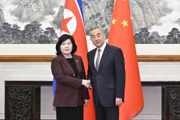 Chinese Foreign Minister Wang Yi (R) met with North Korean Foreign Minister Choe Son Hui in Beijing on Sunday. Both sides agreed to oppose 