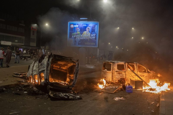 Vehicles burn during a gathering of youth-led protests demanding healthcare and education reforms turns violent, in Sale, Morocco, Wednesday. Photo by Jalal Morchidi/EPA