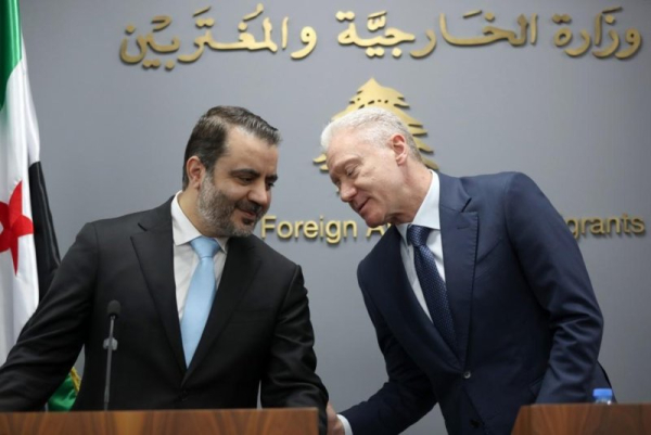 Lebanese Minister of Foreign Affairs and Emigrants Youssef Rajji (R) talks with his Syrian counterpart, Asaad Al Shaibani, during a press conference after their meeting at the Lebanese Foreign Ministry in Beirut, Lebanon, on Friday. Shaibani is on an official visit to Beirut to meet Lebanon's leaders. Photo by Wael Hamzeh/EPA