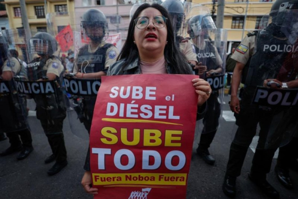 A woman protests rising diesel prices during a demonstration in front of the Ministry of Defense in Quito, Ecuador, on Thursday Ecuador’s Interior Minister John Reimberg threatened to arrest those behind the financing of violence during indigenous protests over rising diesel prices. Photo by Jose Jacome/EPA