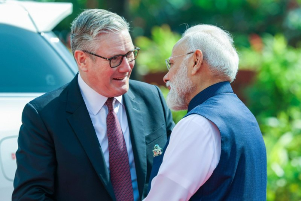 Indian Prime Minister Narendra Modi greets British Prime Minister Keir Starmer in Mumbai Thursday. Starmer is in Mumbai with a delegation to discuss a trade deal and a technology security initiative launched in July. Handout Photo by Press Information Bureau/EPA
