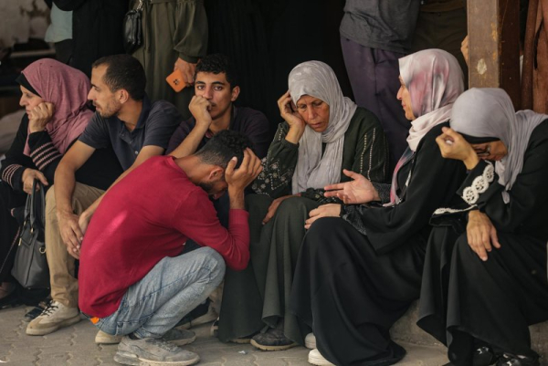 Palestinian relatives of the Abu Shaban family mourn at Al Ahli Baptist Hospital in Gaza City, on Saturday. At least eleven members of the family were killed a day earlier when their car was hit by an Israeli army strike in the Al Zaitun neighbourhood, east of Gaza City. Photo by Mohammed Saber/EPA